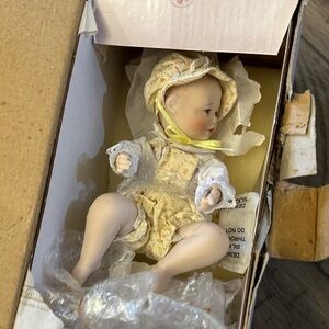 Porcelain Baby Doll in Yellow Outfit